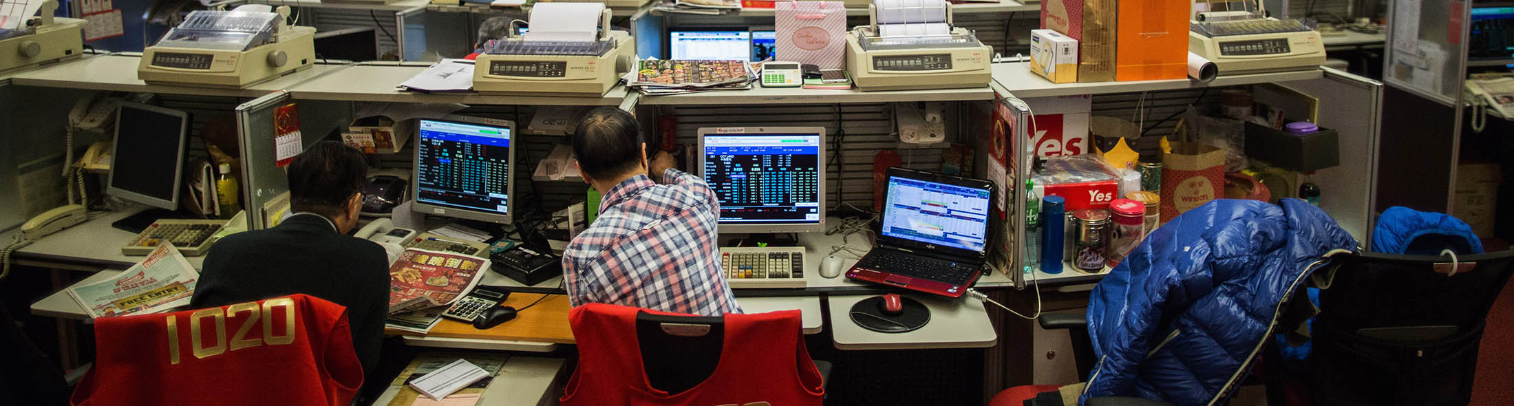 Traders work on the trading floor of the stock exchange in Hong Kong.

