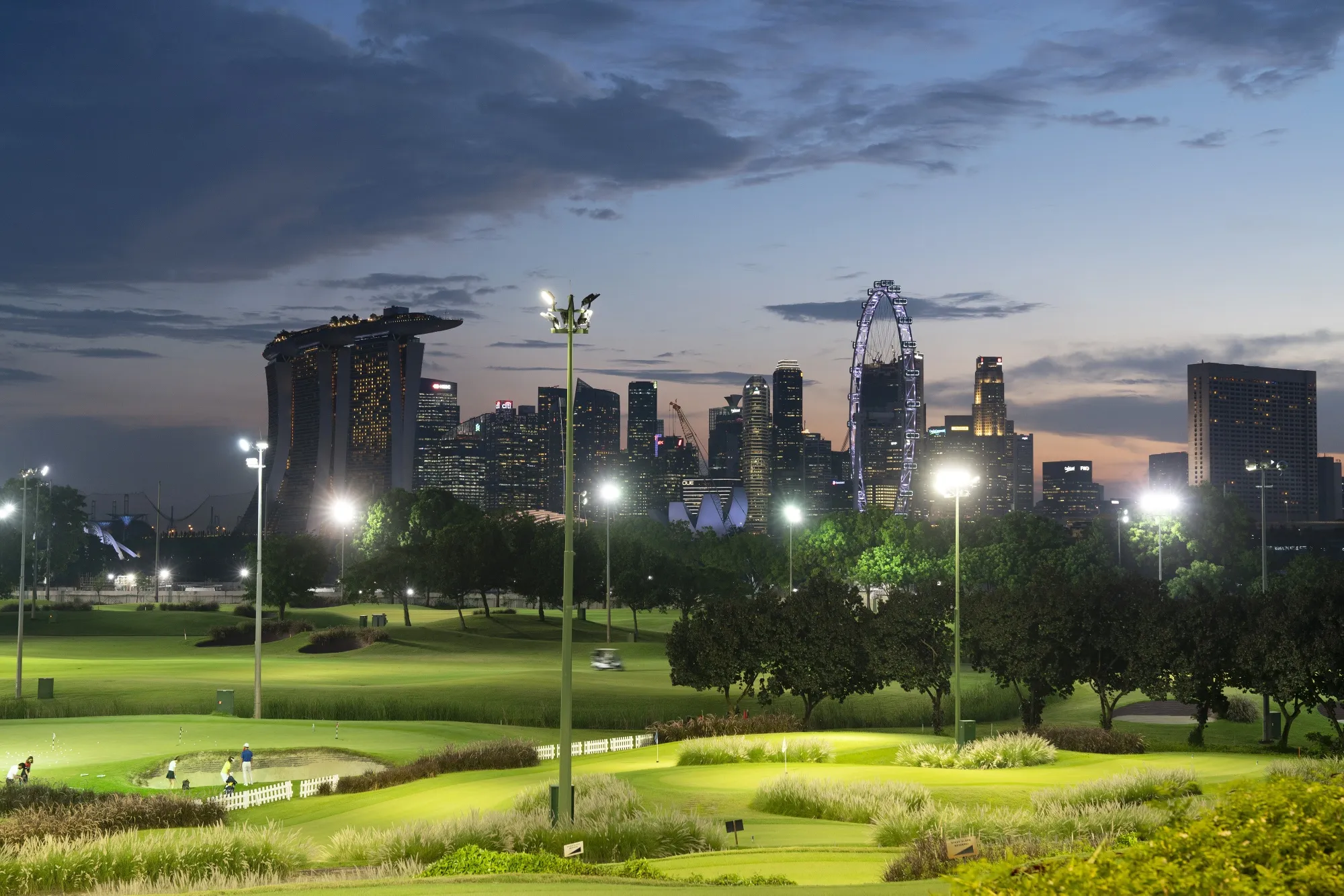 Golfers play in the evening at the Marina Bay Golf Course in Singapore in 2021.