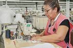 A worker makes protective masks at Eagle Sportswear, in Middlesex, North Carolina.