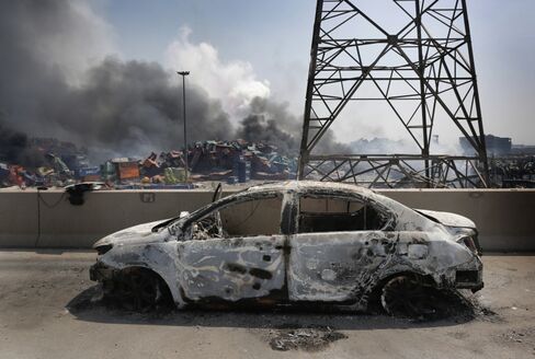 A burnt out car is seen at the site of a massive explosion at a warehouse in Tianjin, China on August 13, 2015.
