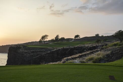 Sunset at the famed 12th Hole (par 3, 202-yard) of the Manele Golf Course, where the fairway is the ocean.