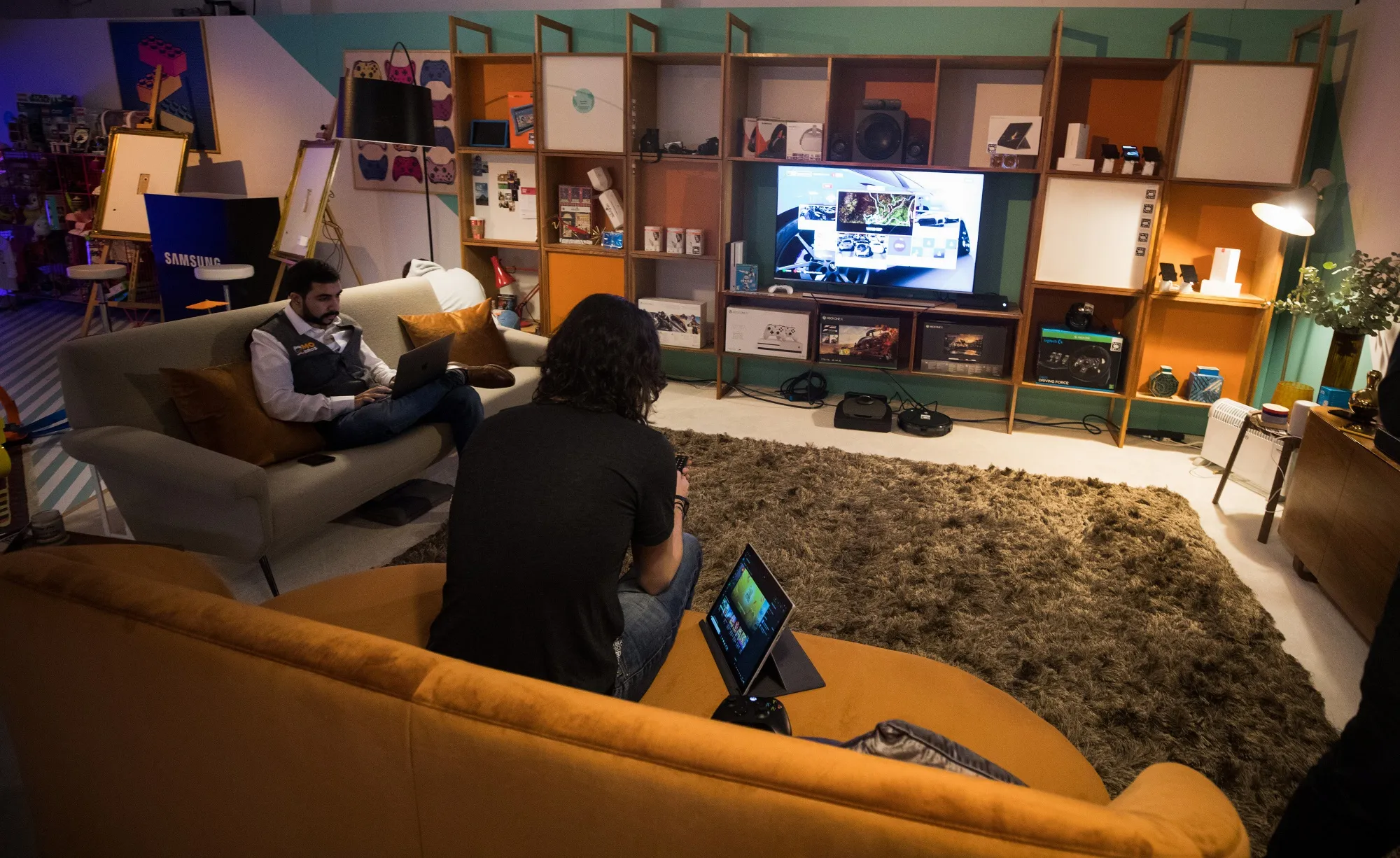 Visitors sit in home entertainment section at the Amazon.com Inc.&nbsp;pop-up store in London.