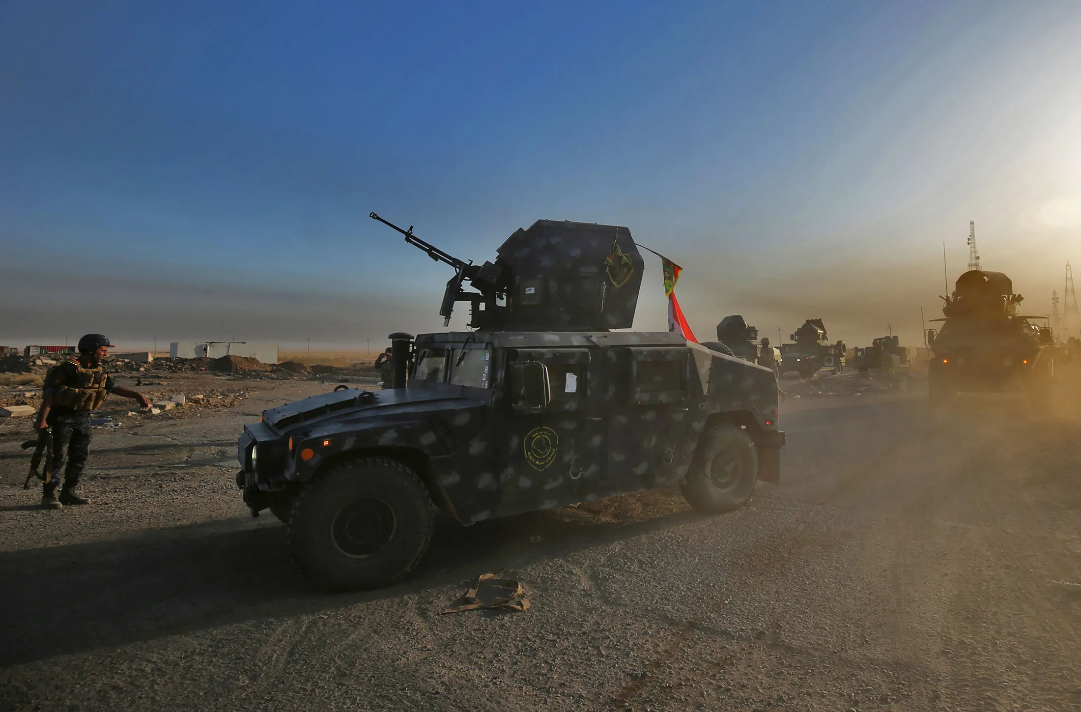 Iraqi forces hold a position some 45 kms south of Mosul, as they advance towards the city.
