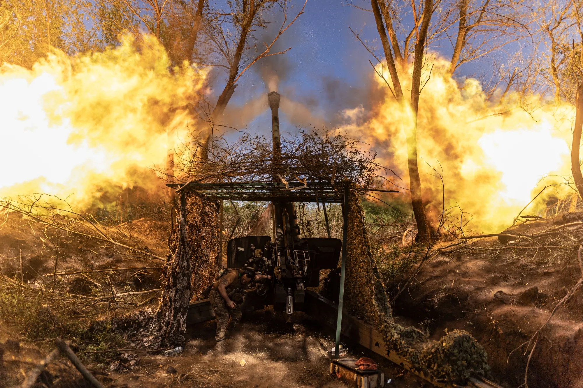 A Ukrainian soldier fires Msta-B artillery&nbsp;in the direction of Liman, Ukraine&nbsp;on May 25.