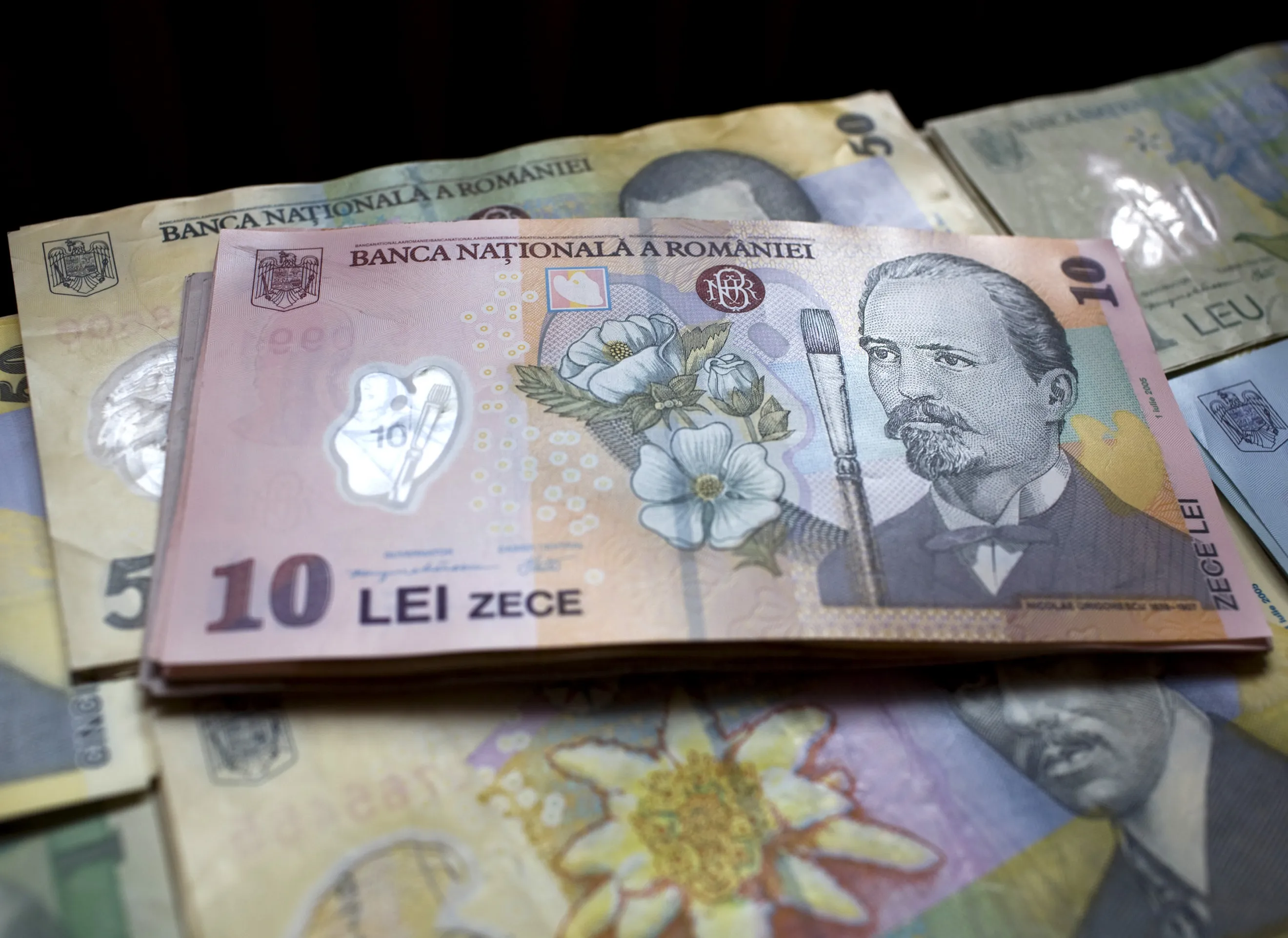 A bundle of ten Romanian leu bank notes sit on display in Bucharest, Romania.