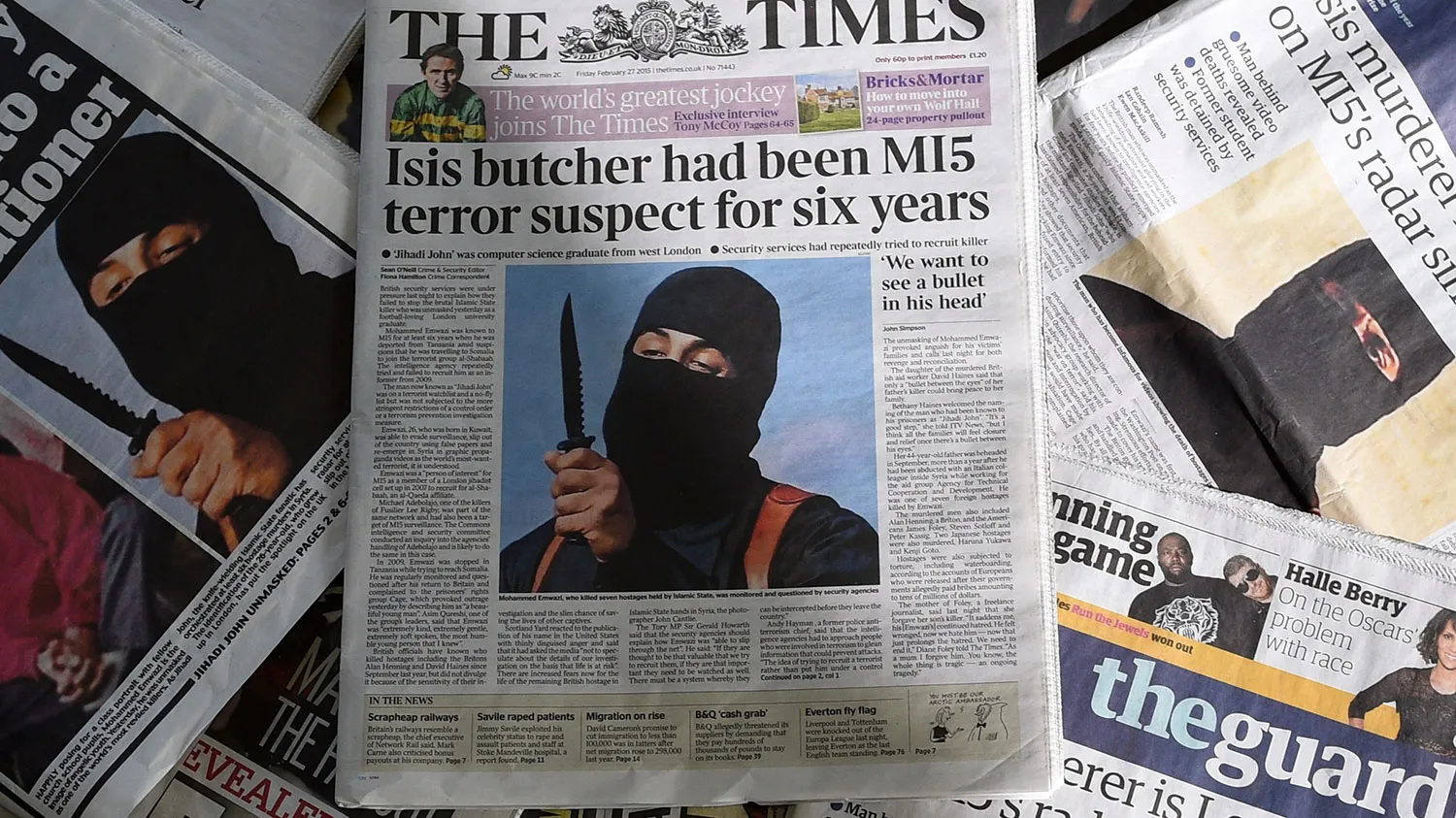 An arrangment of British daily newspapers photographed in London on February 27, 2015 shows the front-page headlines and stories regarding the identification of the masked Islamic State group militant dubbed 'Jihadi John'.

