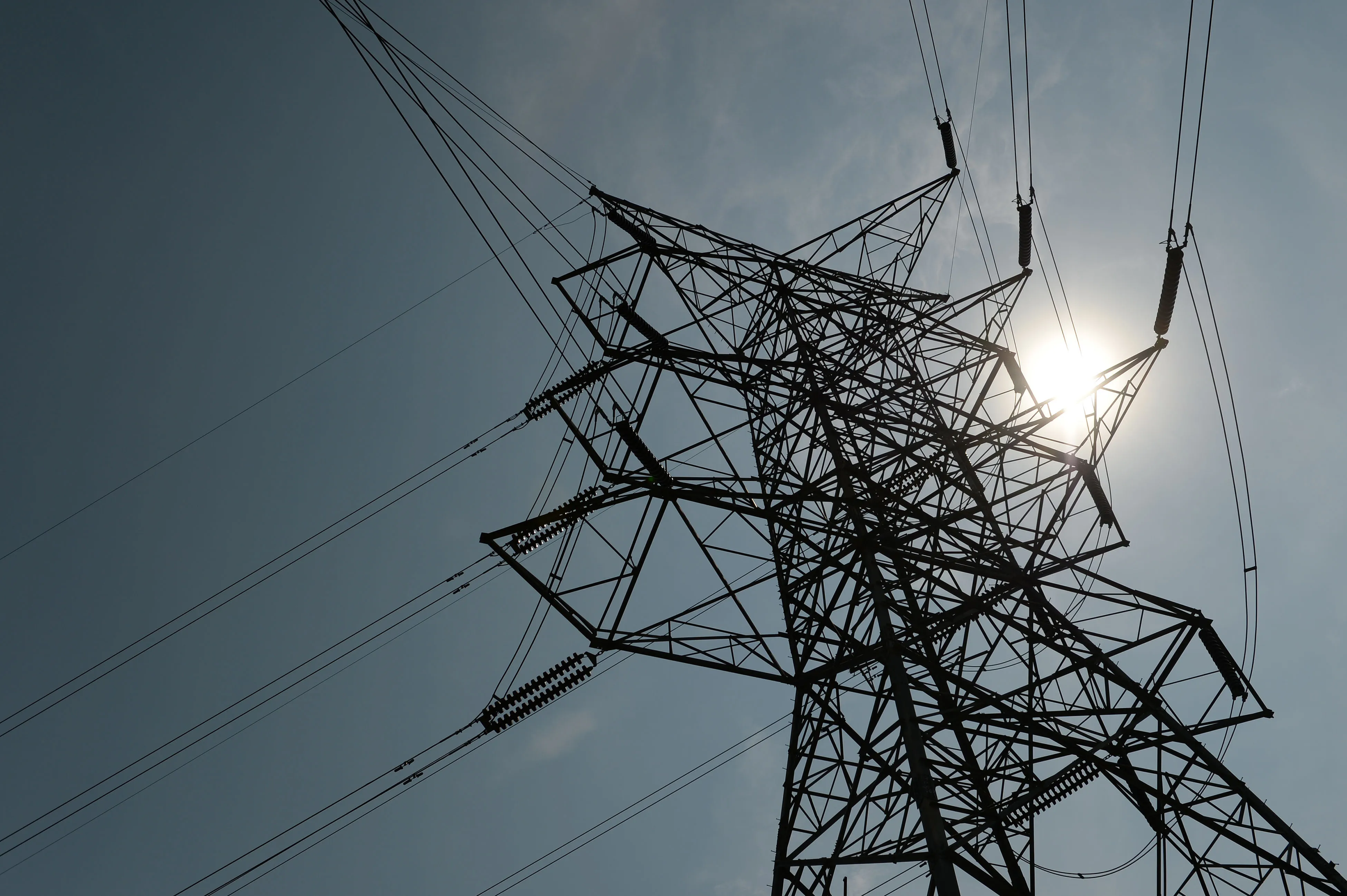 Power lines hang from a transmission tower in Pangkalan Susu, North Sumatra province, Indonesia.