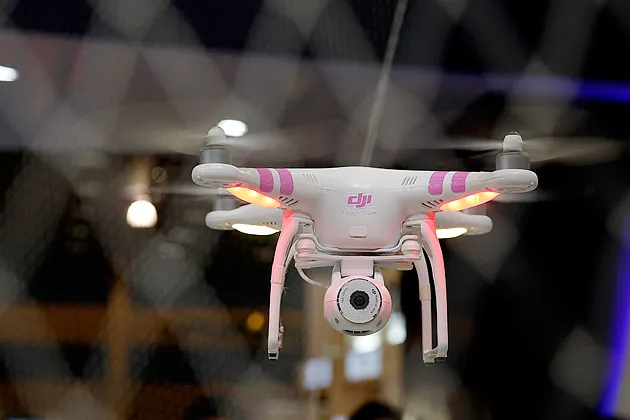 The DJI Phantom drone is demonstrated at CES’s Dajiang Innovation Technology booth