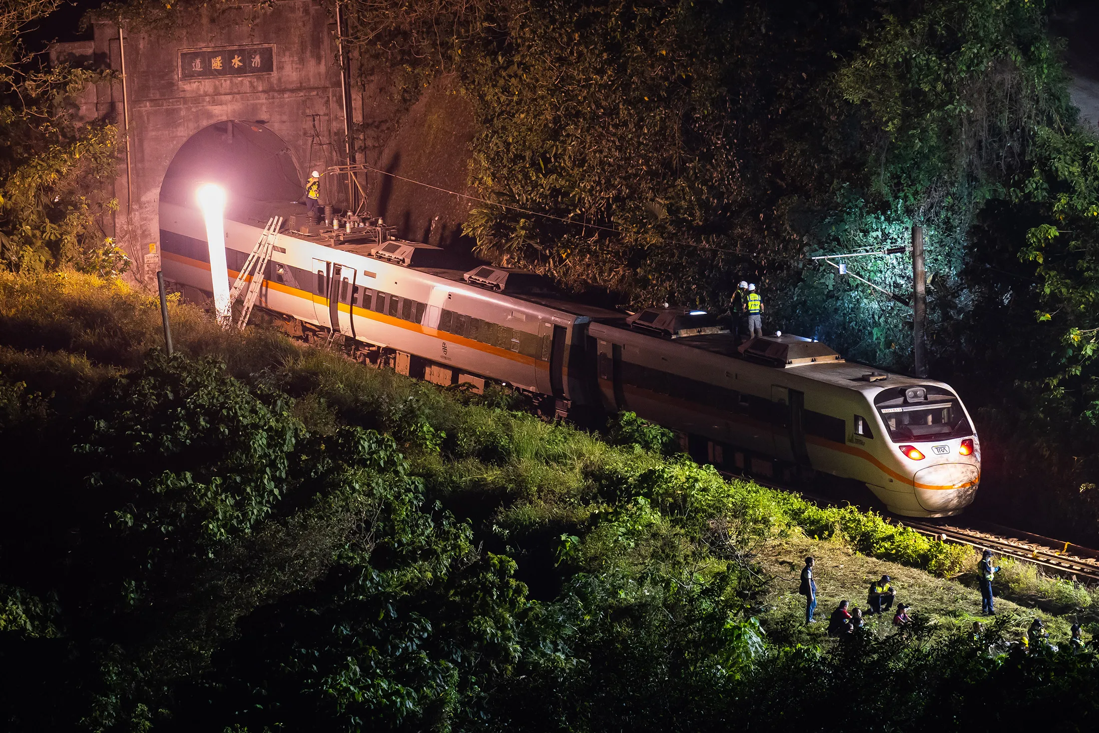 Rescuers work near the site where a train derailed inside a tunnel in the mountains of Hualien on April 2.