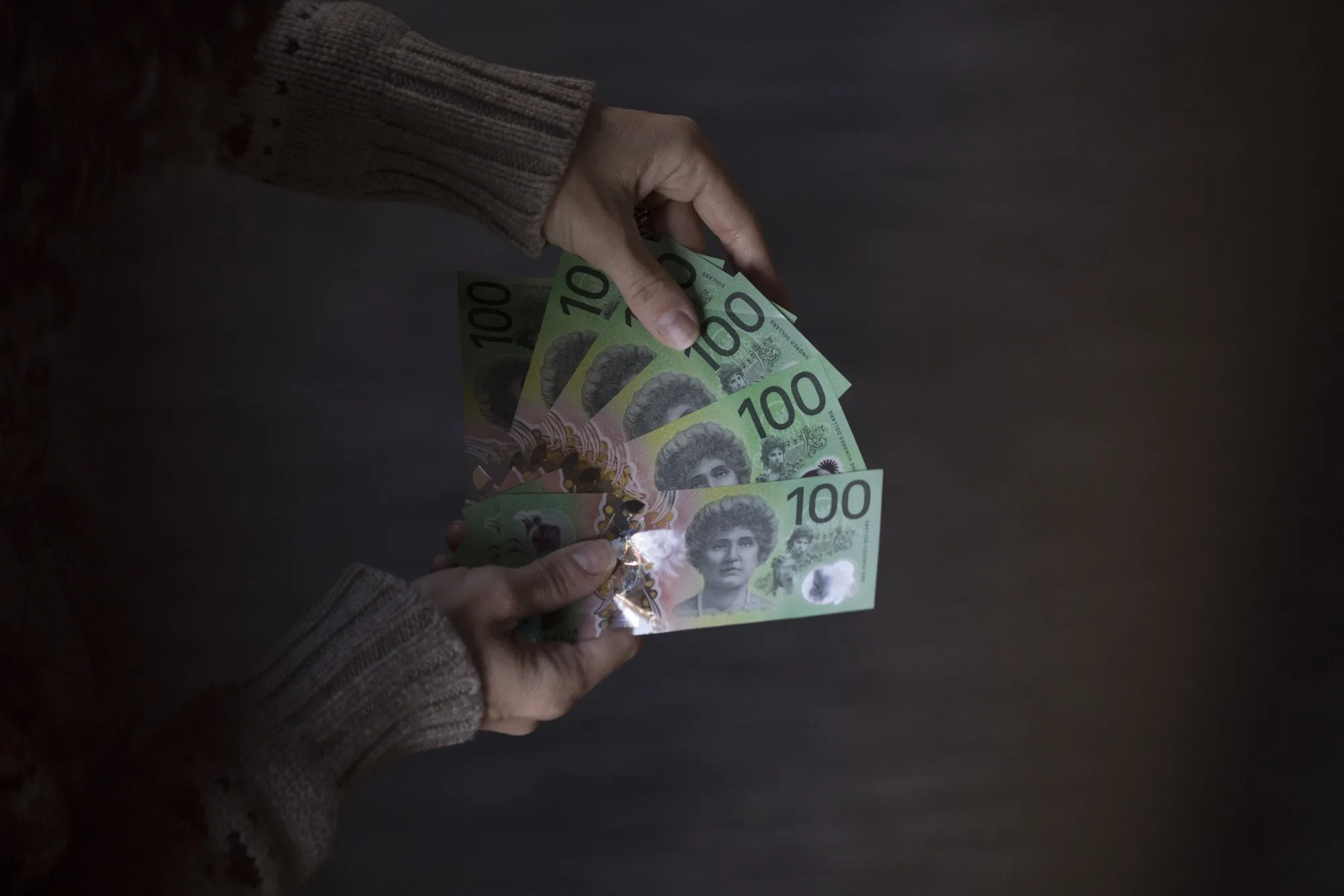 Australian one-hundred dollar banknotes arranged in Sydney.