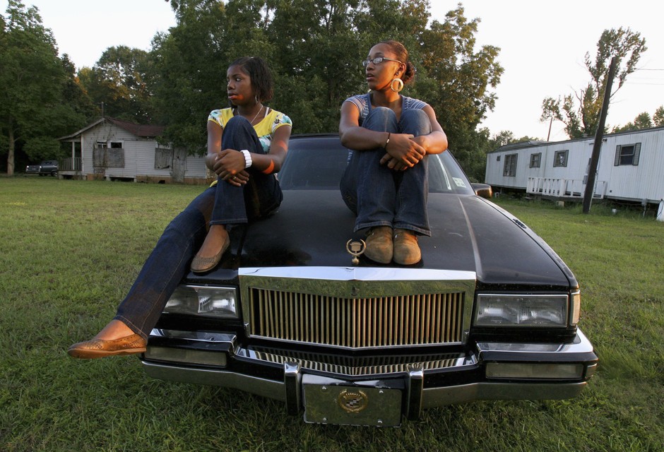 Toria Bowens, 18, a senior at Jena High School, sits with freshman Jimekia Howard, 14, as they watch supporters of the &quot;Jena 6&quot; arrive in Jena, Louisiana, in 2007. A new report looks at how girls of color are faring in schools today.