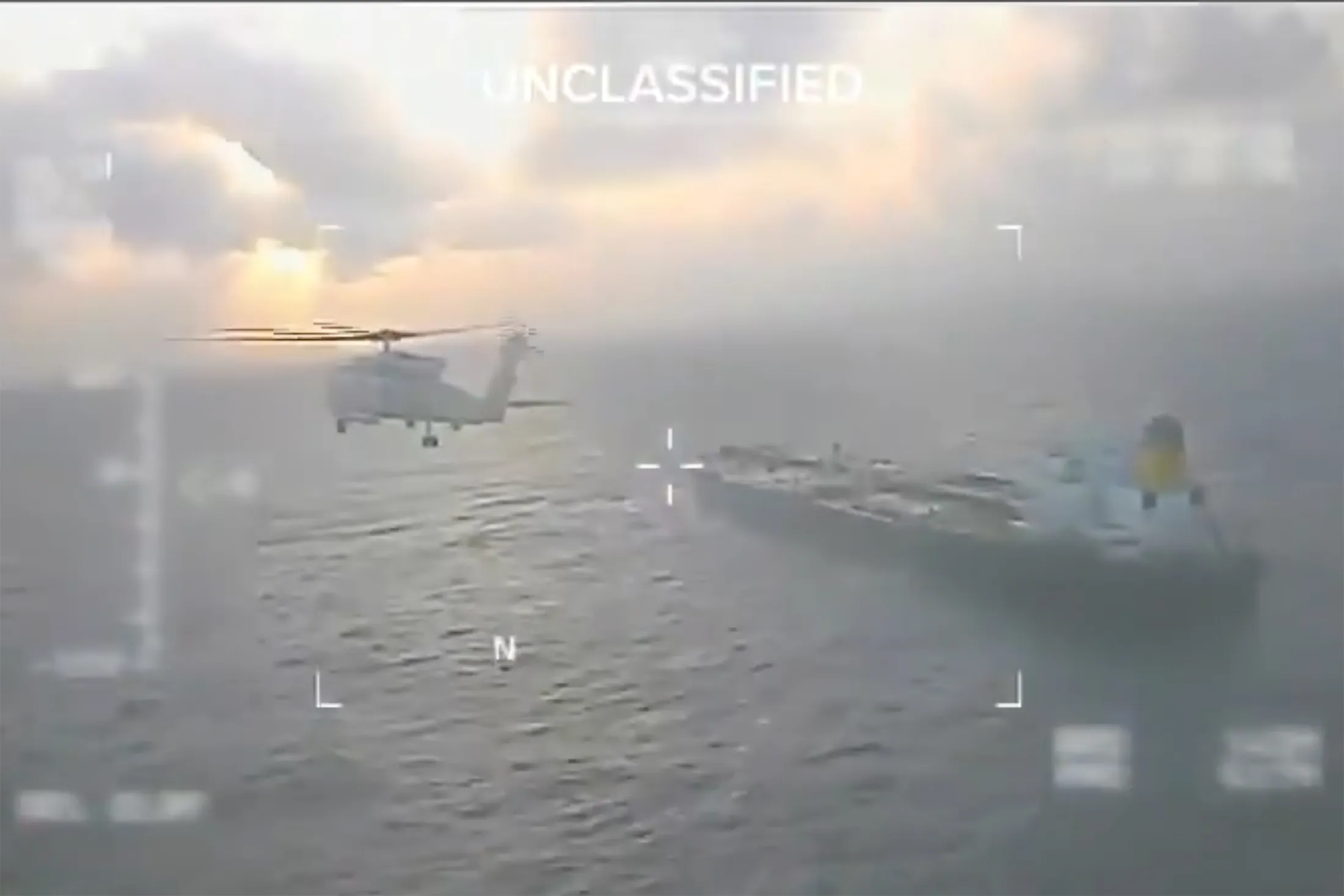 A helicopter flies over the Centuries tanker, in an image from a video released by Homeland Security Secretary Kristi Noem on social media, on Dec. 20, 2025.