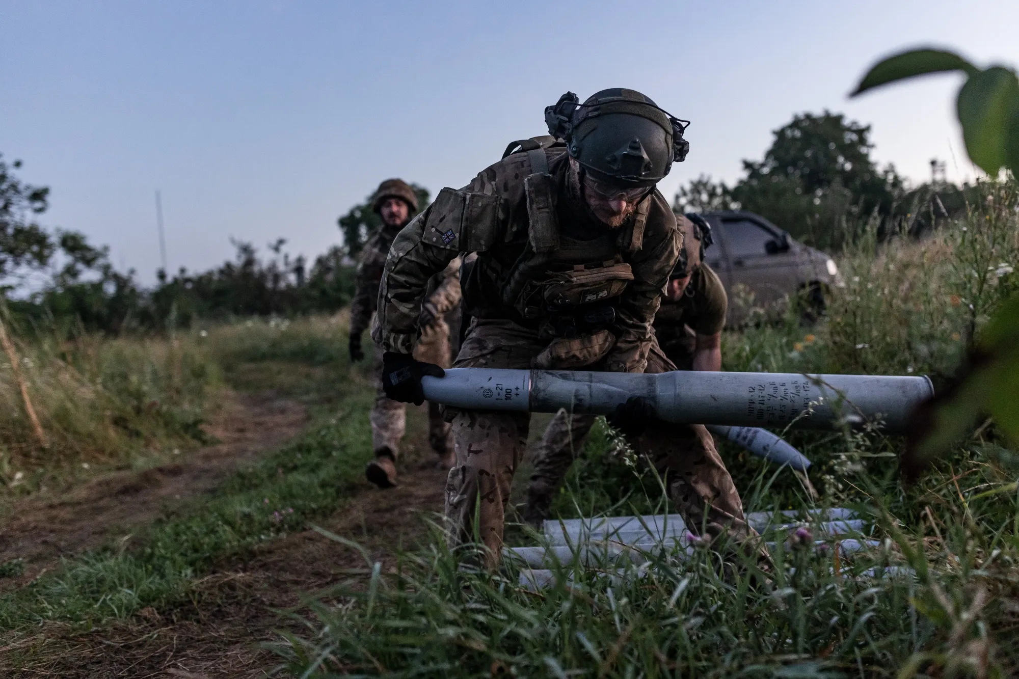 A Ukrainian soldier carries shells to a front line position in Donetsk Oblast, Ukraine on July 22.