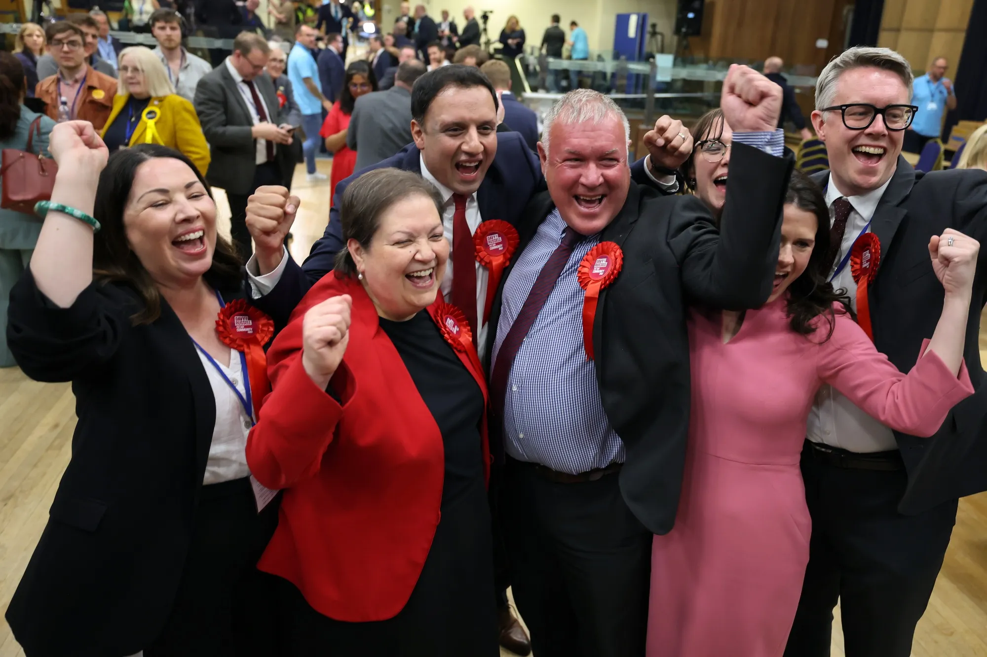 Davy Russell, center right, celebrates with Anas Sarwar, leader of the Labour Party, center left, after winning the Hamilton, Larkhall and Stonehouse by-election on June 6.