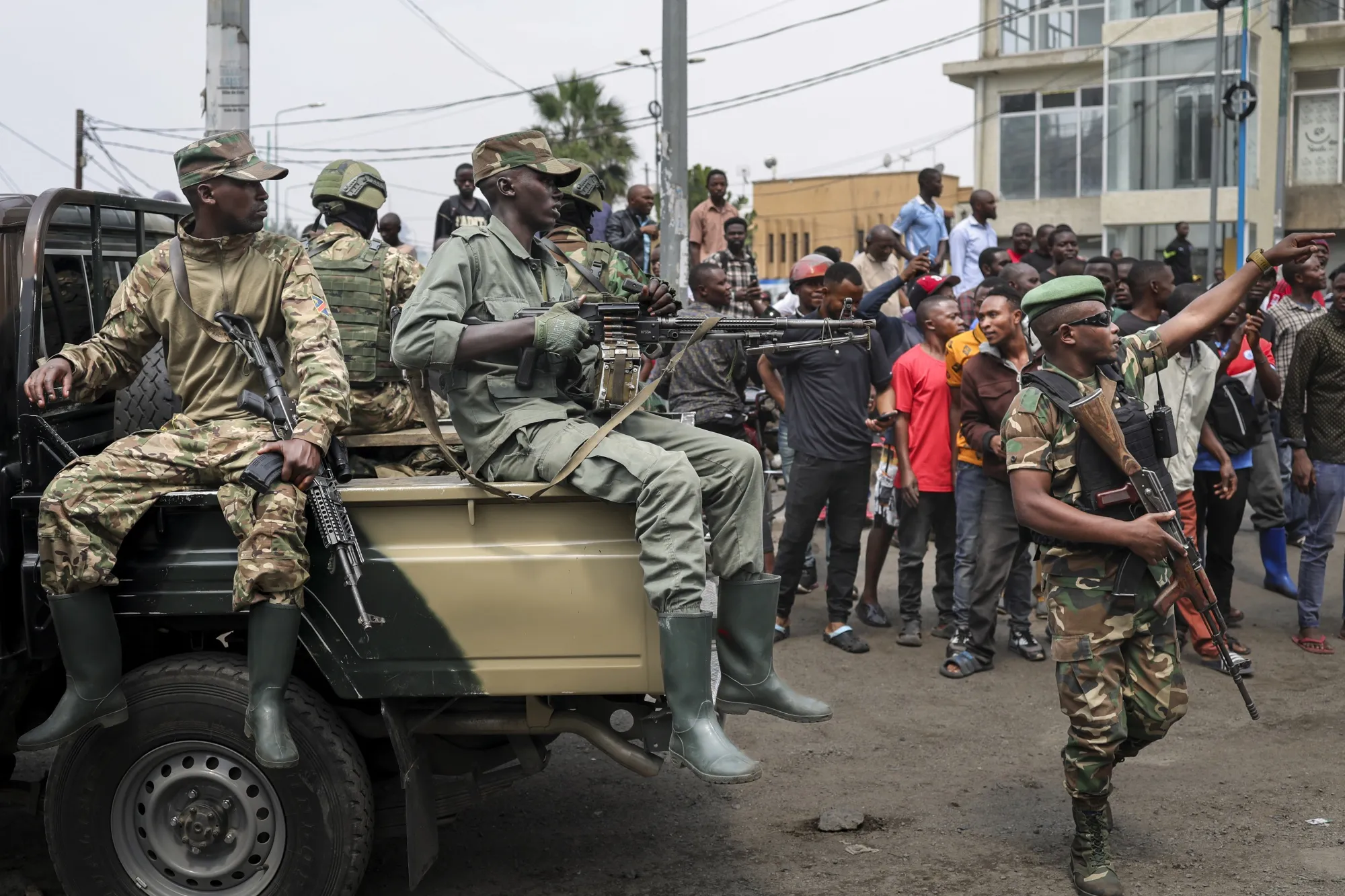 Members of the M23 armed group secure a street&nbsp;in Goma on Feb. 1.&nbsp;