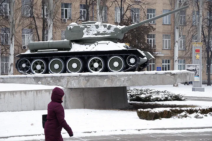 A woman walks past a World War II-era Soviet T-34 tank at a display&nbsp;in Kyiv, Ukraine, on Jan. 25.&nbsp;