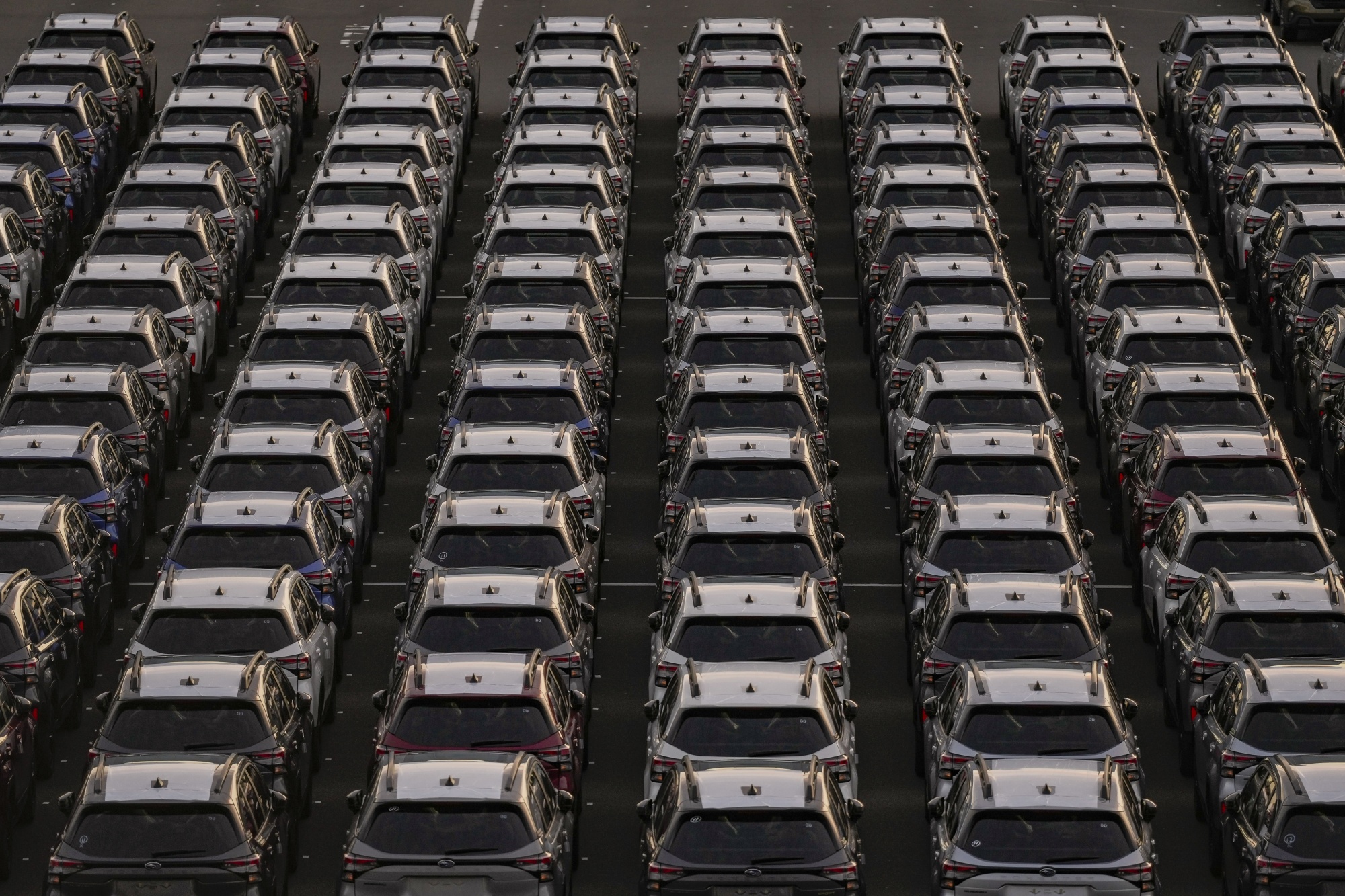 New Subaru vehicles bound for shipment at Yokohama Port in Japan. Photographer: Toru Hanai/Bloomberg