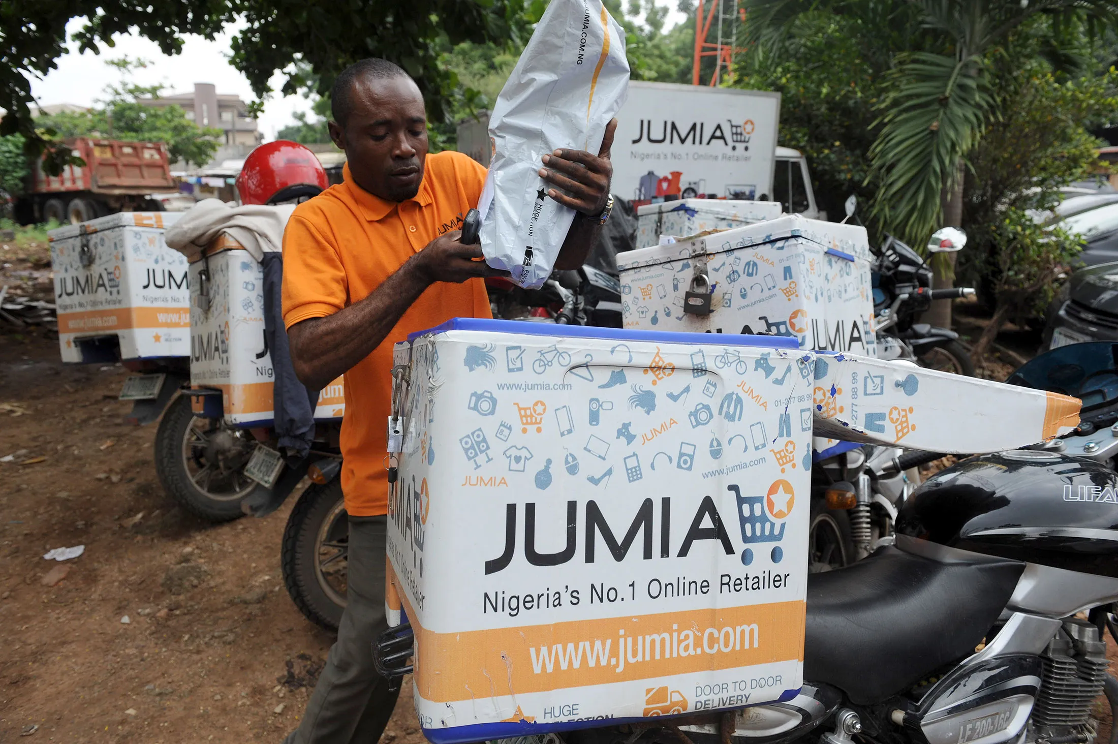 A Jumia scooterman arranges product to be delivered to clients at the Ikeja warehouse of the company in lagos.