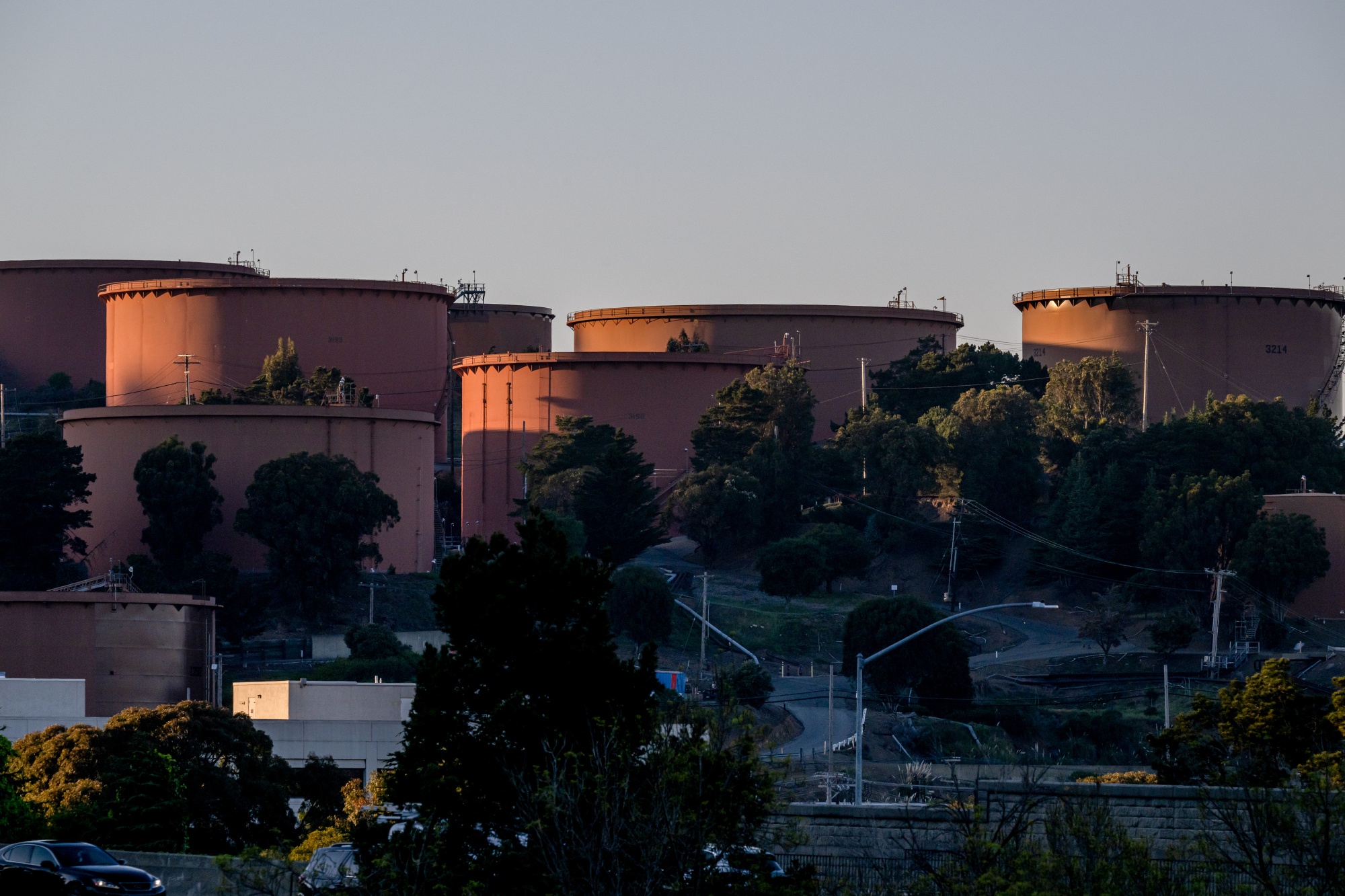 Storage tanks at the Chevron refinery in Richmond, California, US, on Thursday, March 19, 2026. US diesel rose above $5 a gallon for the first time since December 2022, the latest sign of surging fuel price pressures menacing the global economy as the war in Iran continues to disrupt energy supplies. Photographer: David Paul Morris/Bloomberg