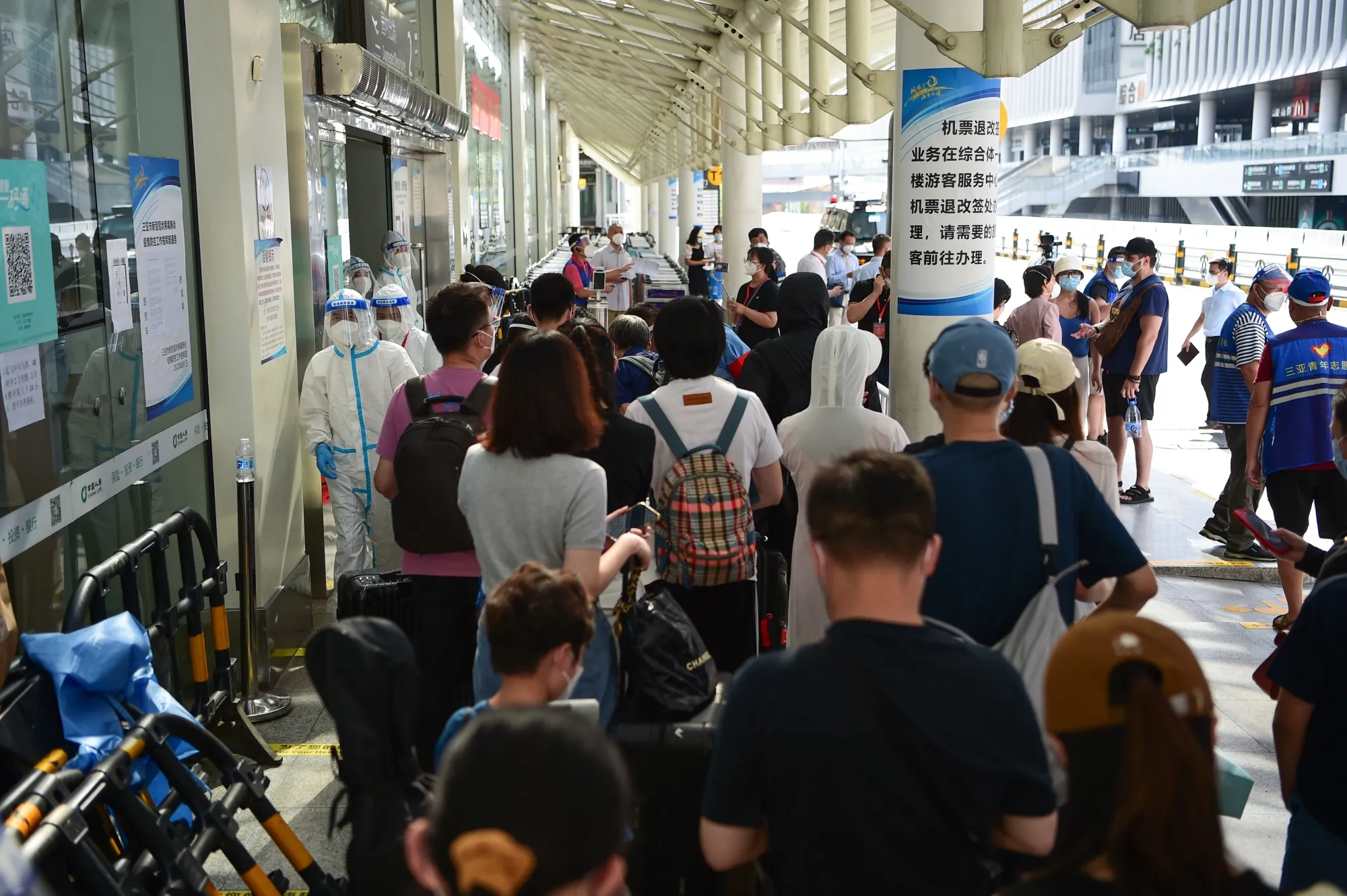Tourists at Sanya Phoenix International Airport in Hainan Province on Aug. 11.