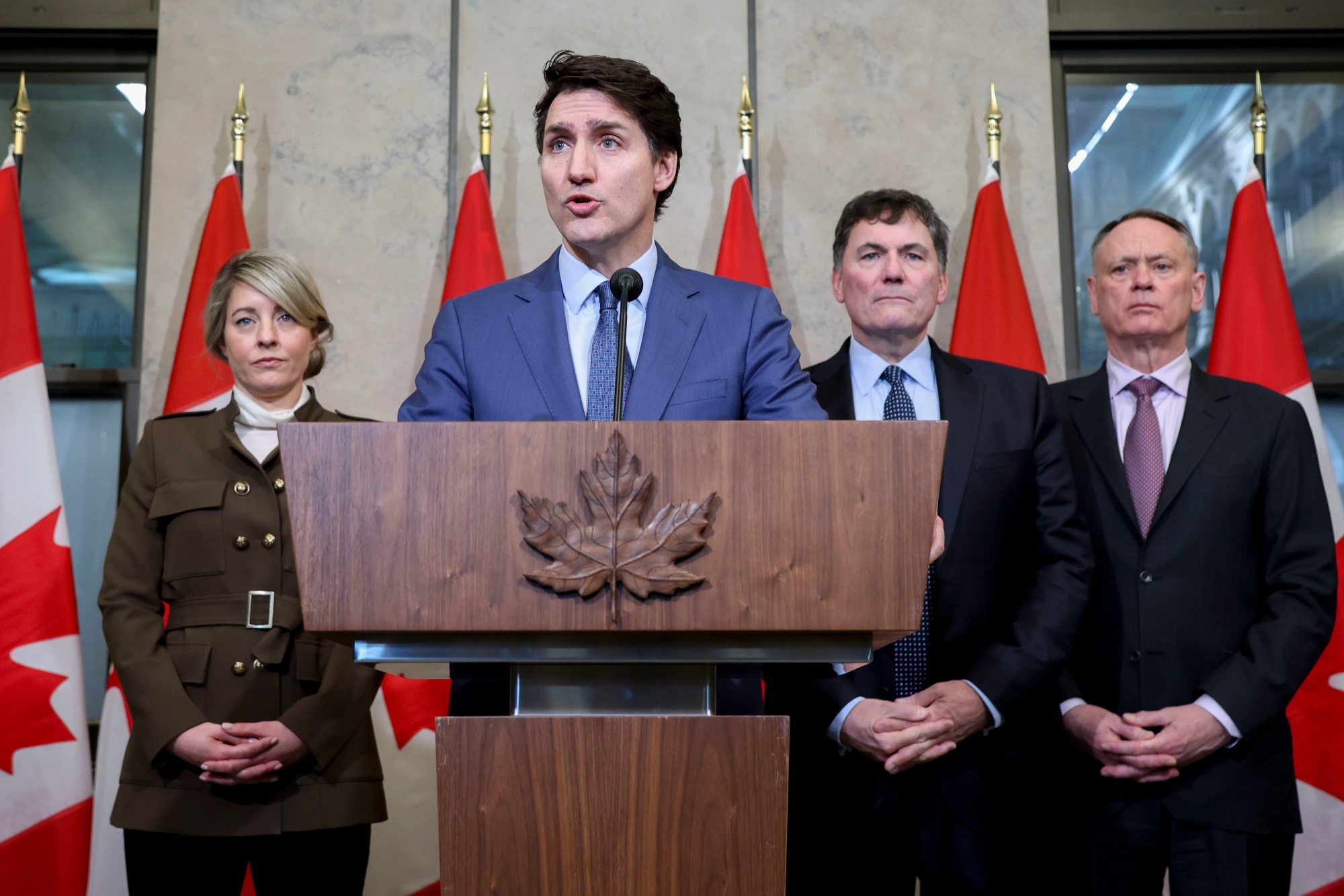 Melanie Joly, from left, Justin Trudeau,&nbsp;Dominic LeBlanc,&nbsp;and David McGuinty during a news conference in Ottawa, Ontario, on&nbsp;March 4.