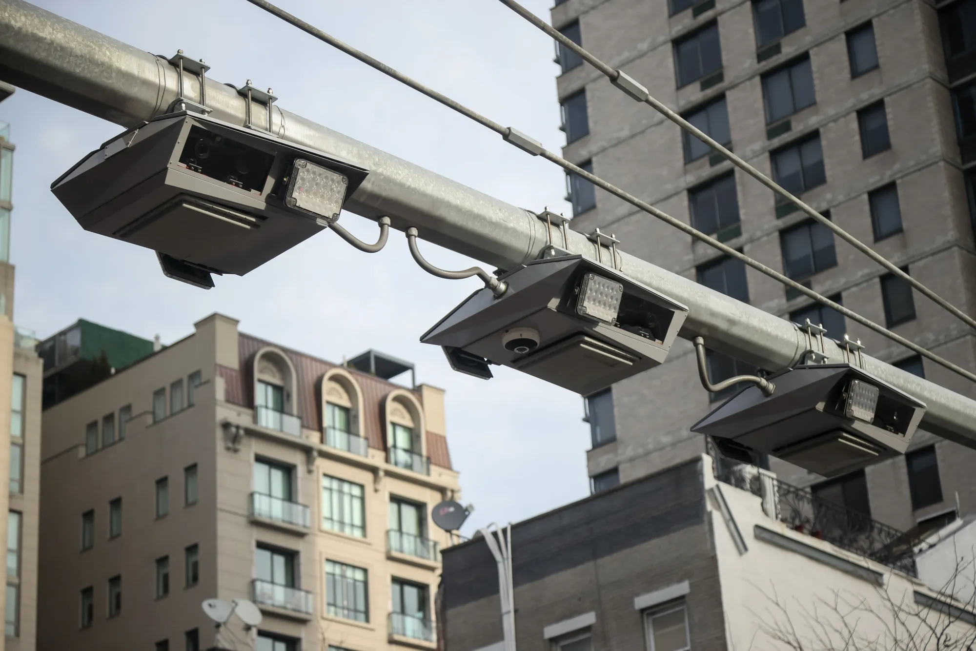 E-ZPass readers and license plate-scanning cameras over Second Avenue in New York.