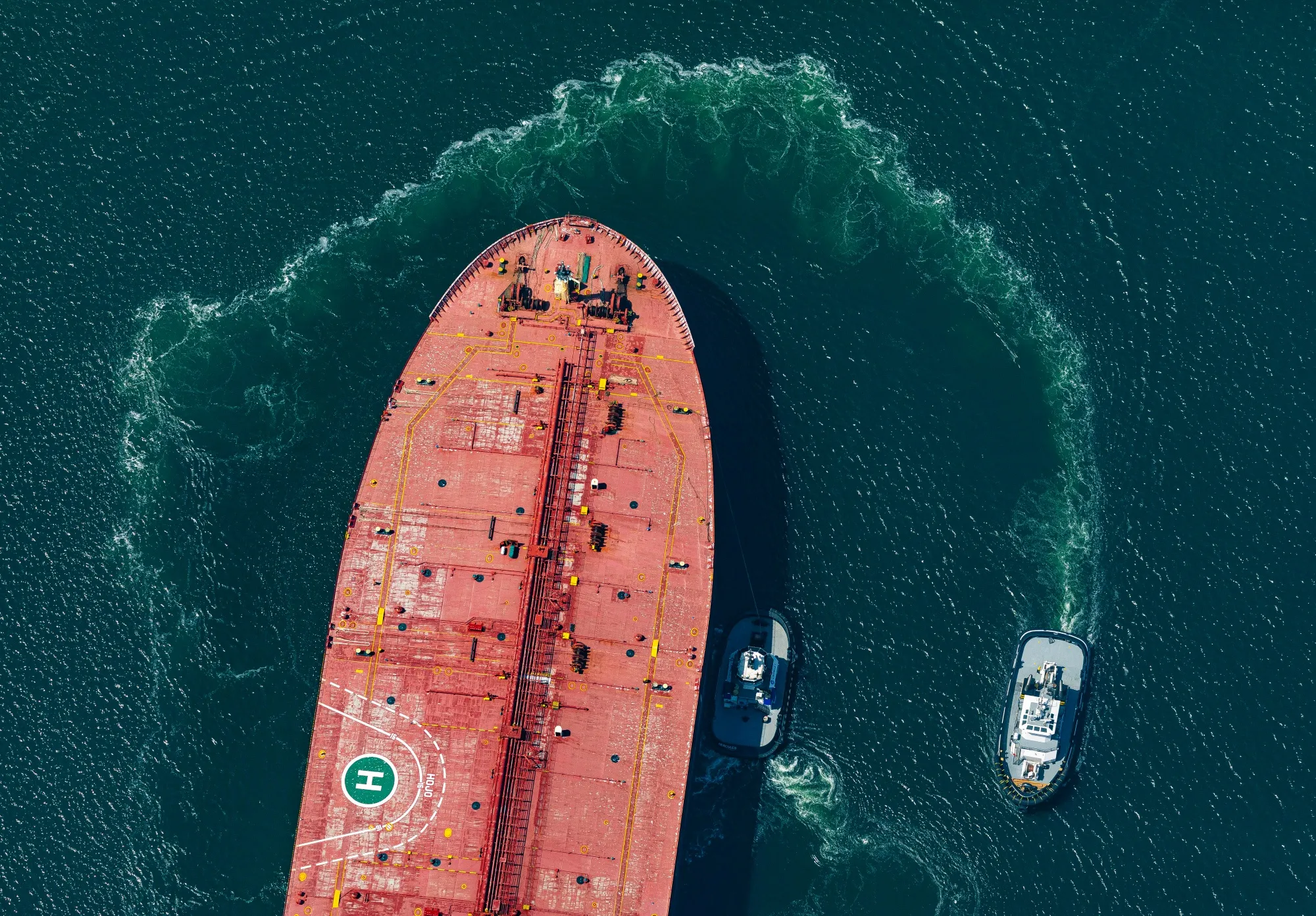 A tug boat assists an oil tanker to its berth at the Port of Long Beach in California.