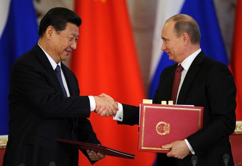 Xi's First State Trip Yields ‘Breakthrough’ Oil Deals With Putin