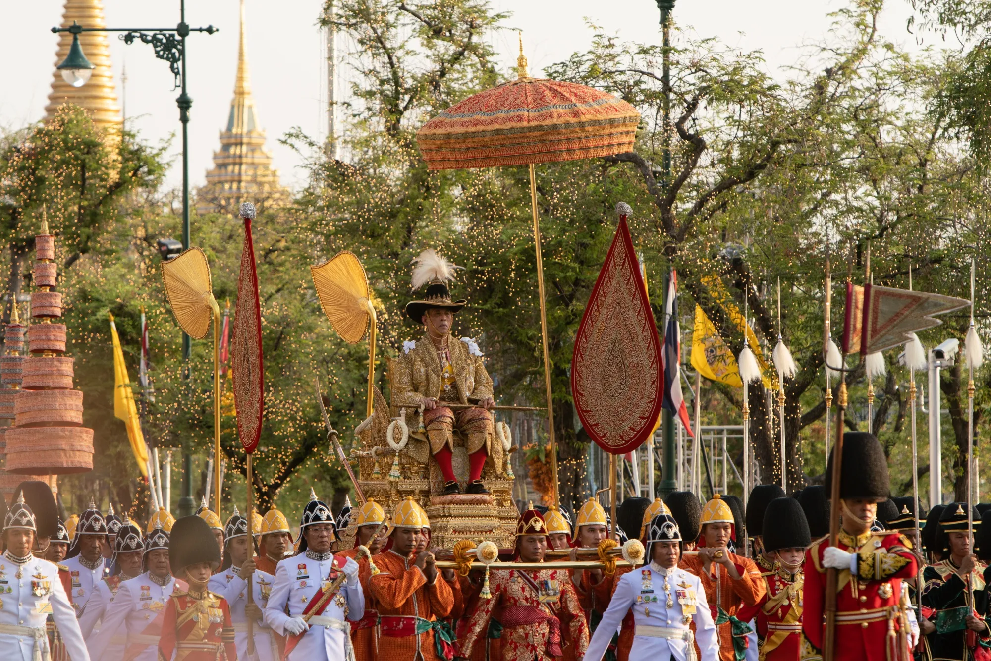 King Maha Vajiralongkorn sits on a golden palanquin during his royal procession in Bangkok on May 5.
