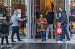 Shoppers wearing protective masks exit a store in San Francisco&nbsp;on&nbsp;Dec. 14.&nbsp;