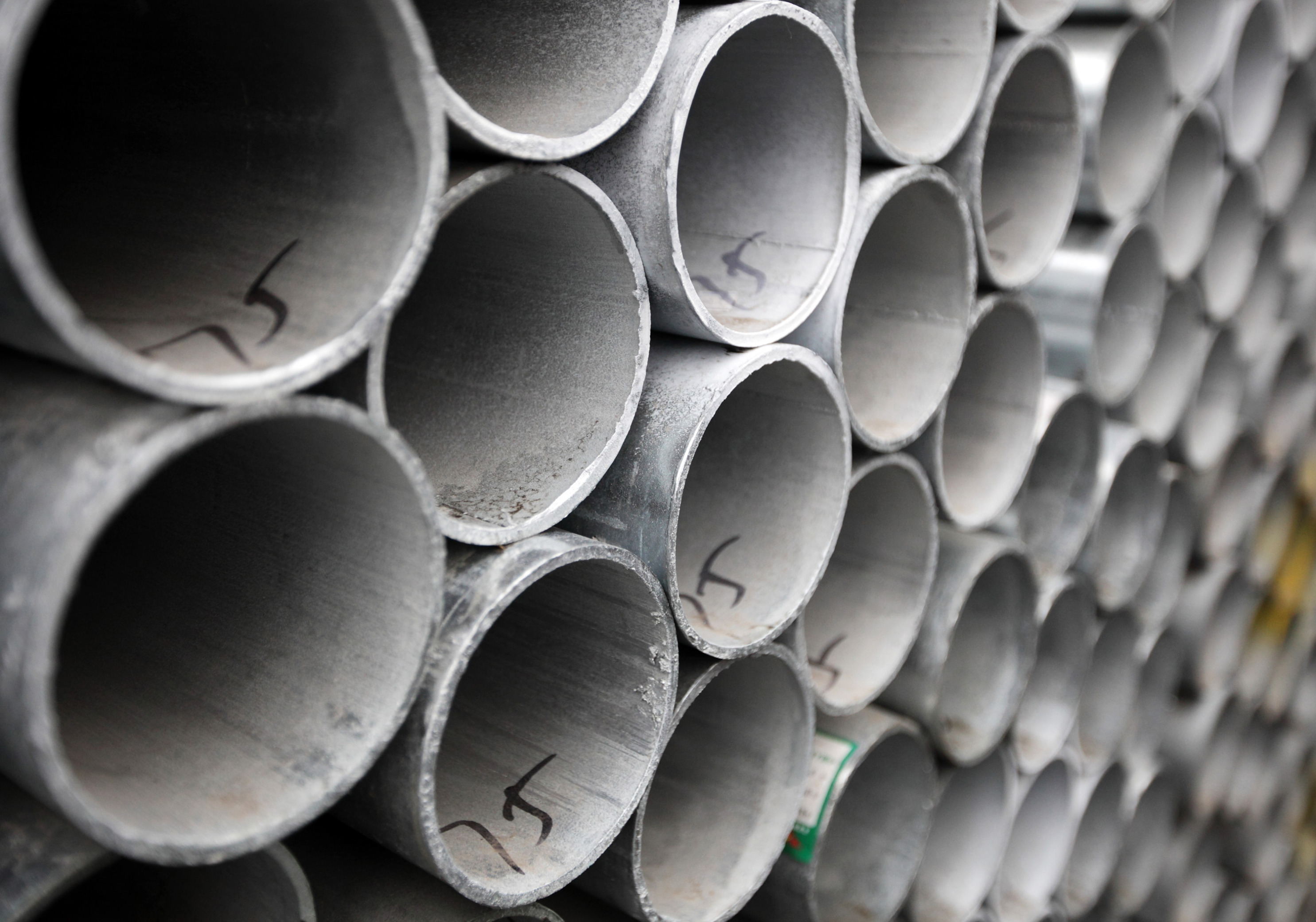 Steel pipes are stacked at a storage yard in Shanghai, China, on Friday, Feb. 1, 2013. Commodities rose, capping the longest run of weekly gains in 17 years, on mounting speculation that the economies in the U.S. and China will rebound, boosting demand for metals, energy and crops.
