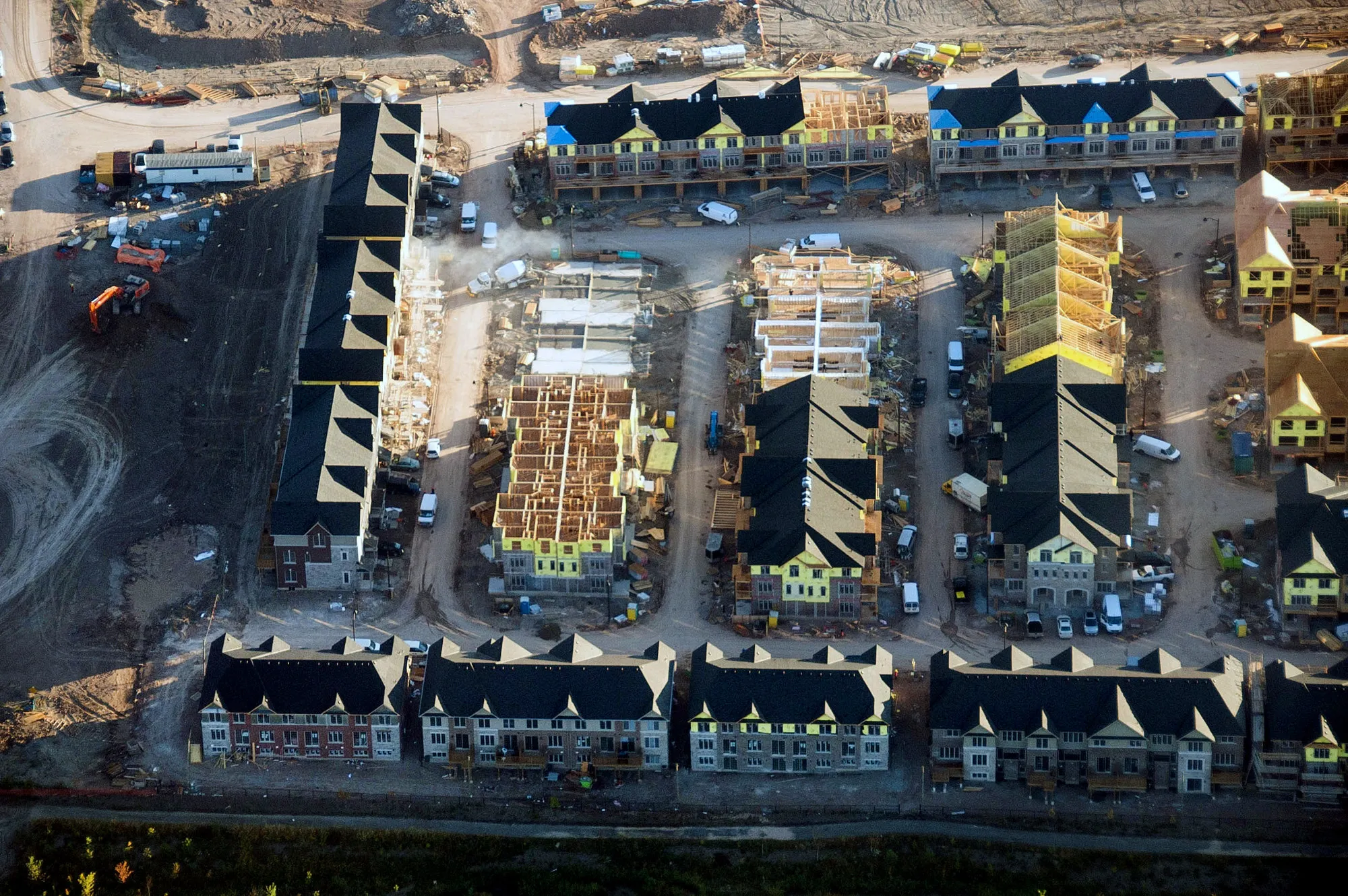 Homes under construction stand in Toronto.