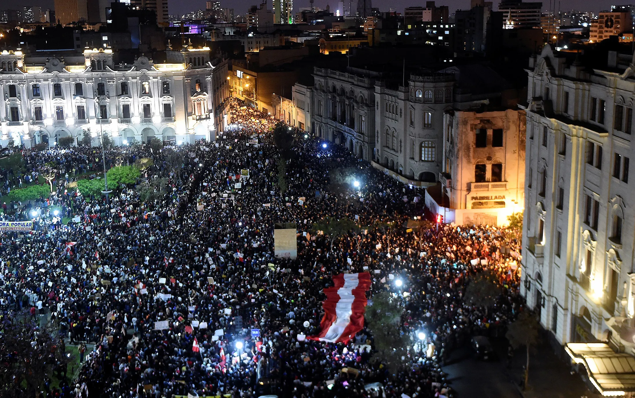 Demonstrators gather during a protest at the San Martin square in Lima on Thursday.