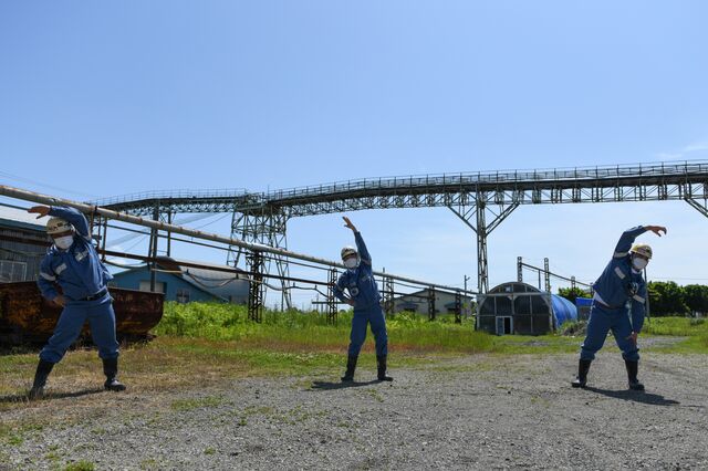 Vietnamese trainee workers exercise before work at Kushiro Coal Mine Co. Photographer: Noriko Hayashi/Bloomberg