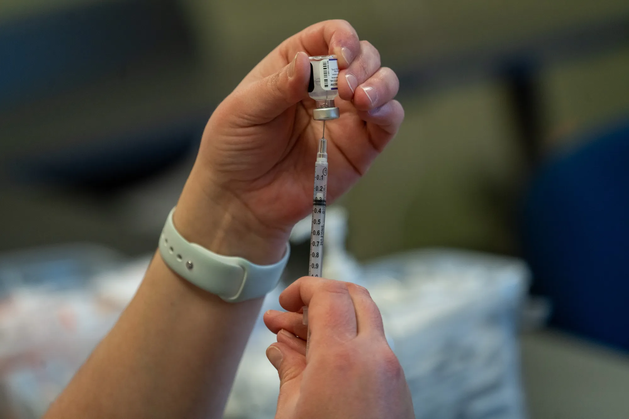 A healthcare worker prepares a dose of the Pfizer-BioNTech Covid-19 vaccine at a vaccination clinic&nbsp;in Peabody, Massachusetts.