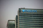 The offices of Barclays Plc, right, and HSBC Holdings Plc stand in the Canary Wharf business.