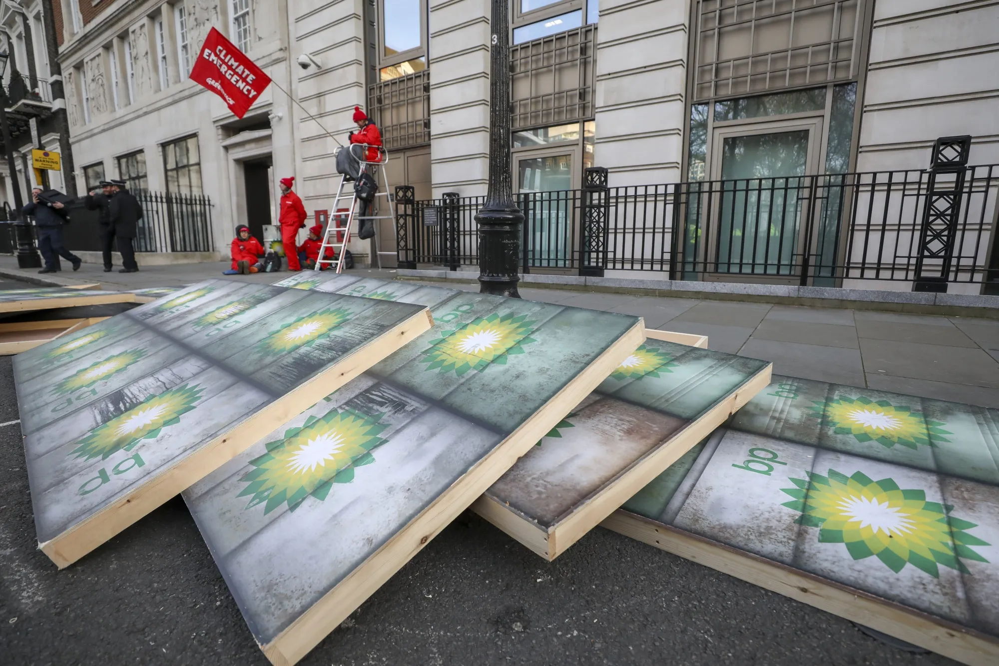 Placards lie on the ground during a protest by Greenpeace activists outside the BP Plc headquarters in London on Feb. 5.