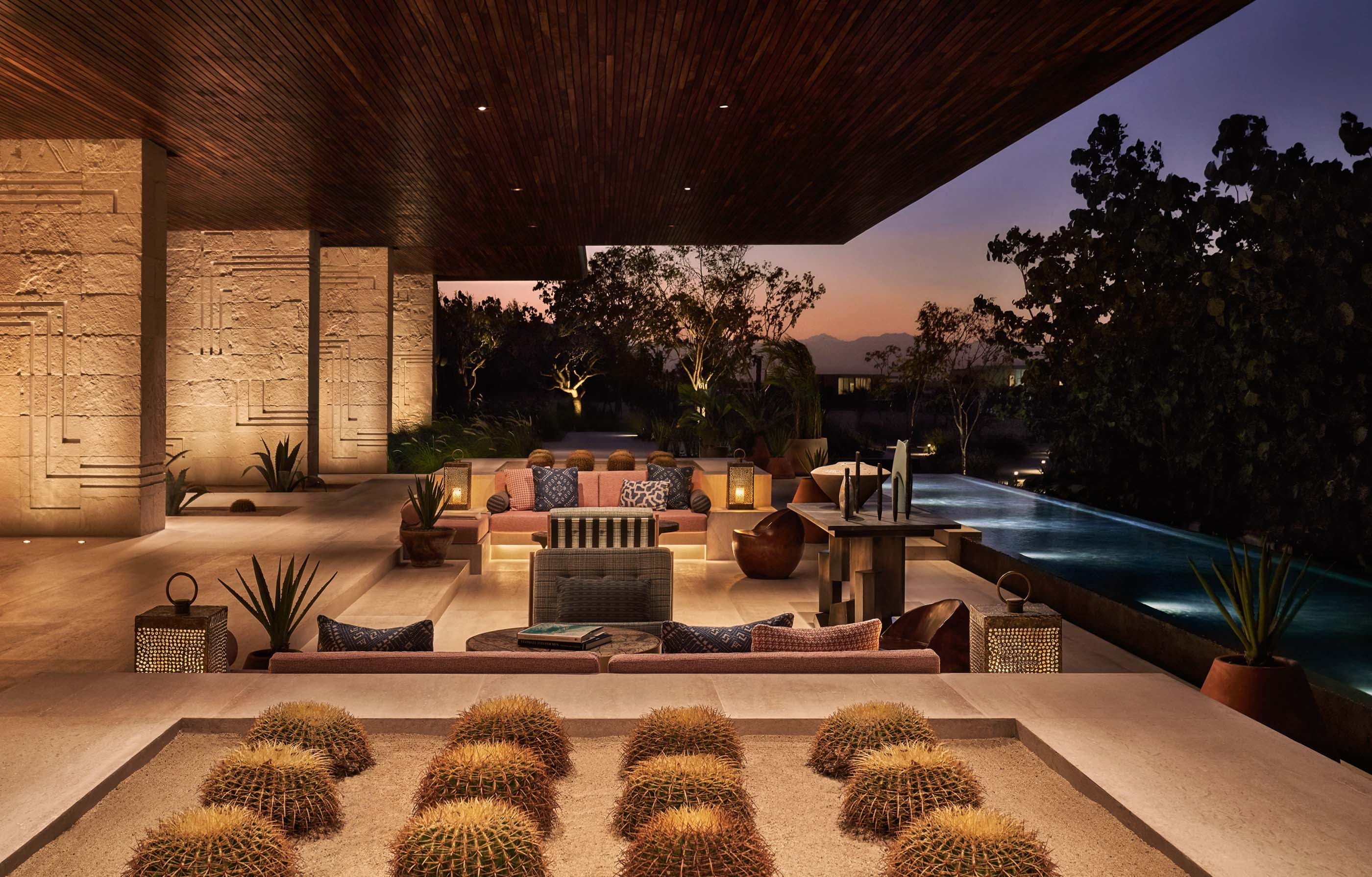 Cacti and sunken seating flank a reflecting pool in the lobby of the Four Seasons Los Cabos at Costa Palmas.