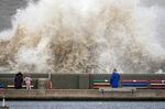 Waves hit the sea wall at New Brighton promenade on February 17 in Liverpool, England. A red alert has been declared for Storm Eunice which is arriving in the early hours of Friday in the wake of Storm Dudley.
