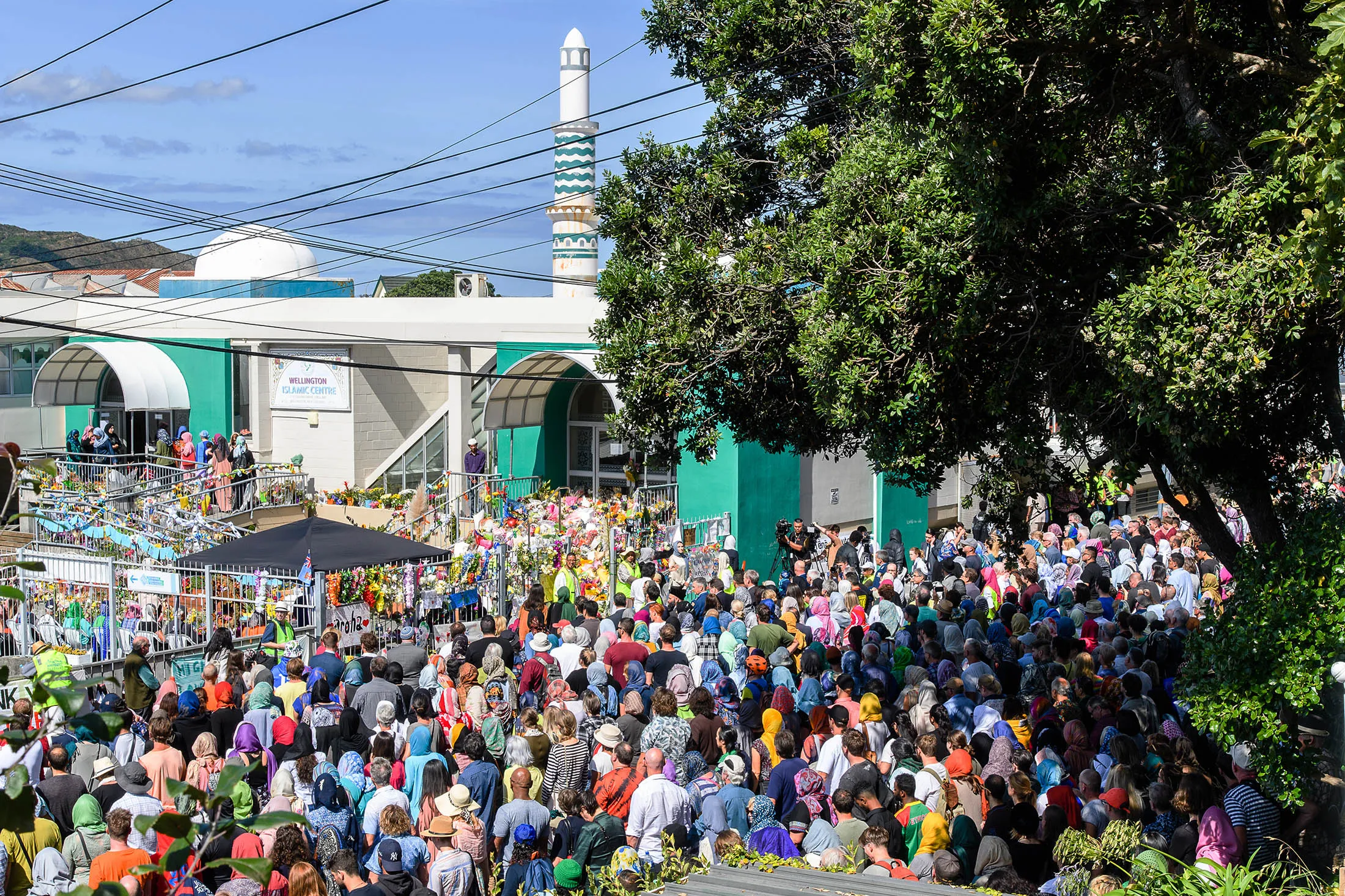 People gather for two minutes of silence outside the Kilbernie Mosque in Wellinton on March 22.