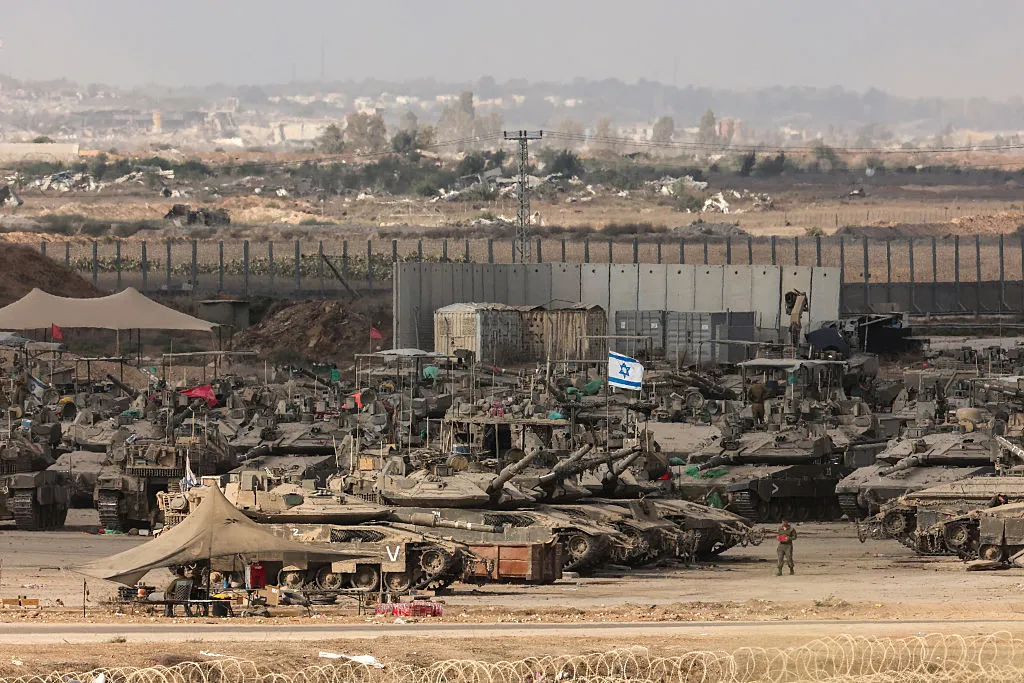 Israeli troops deploy at the border fence with the Gaza Strip in southern Israel.