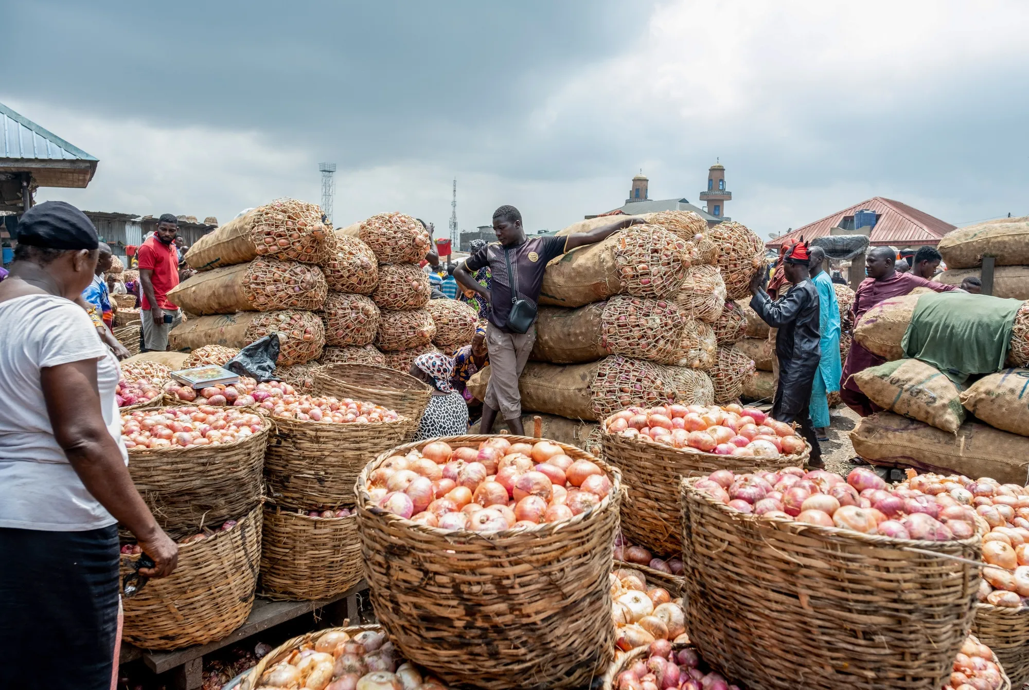 A trader selling onions at the Mile 12 food market in Lagos, Nigeria.
