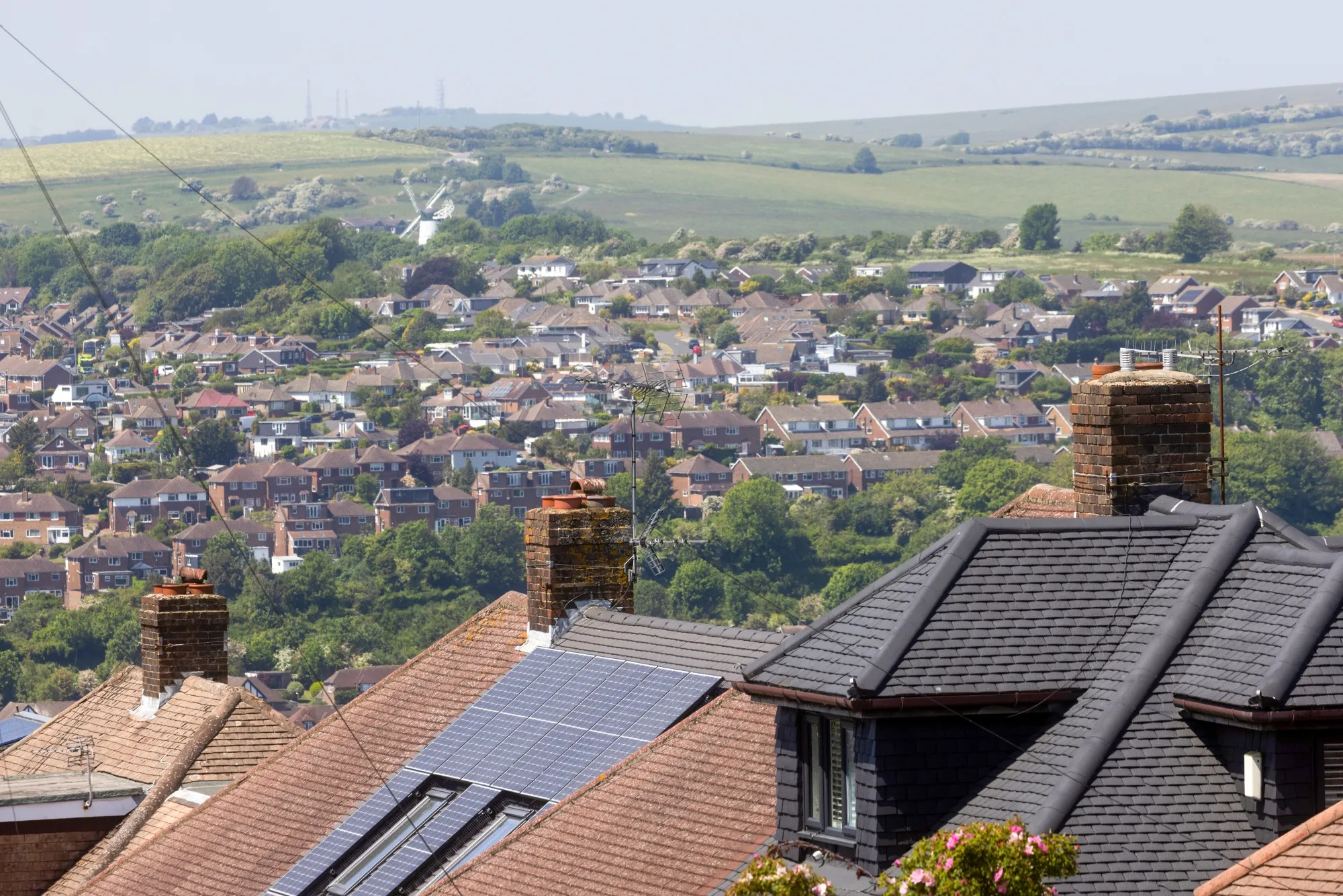 Solar panels on the rooftop of a residential house in a suburb of Brighton, UK.