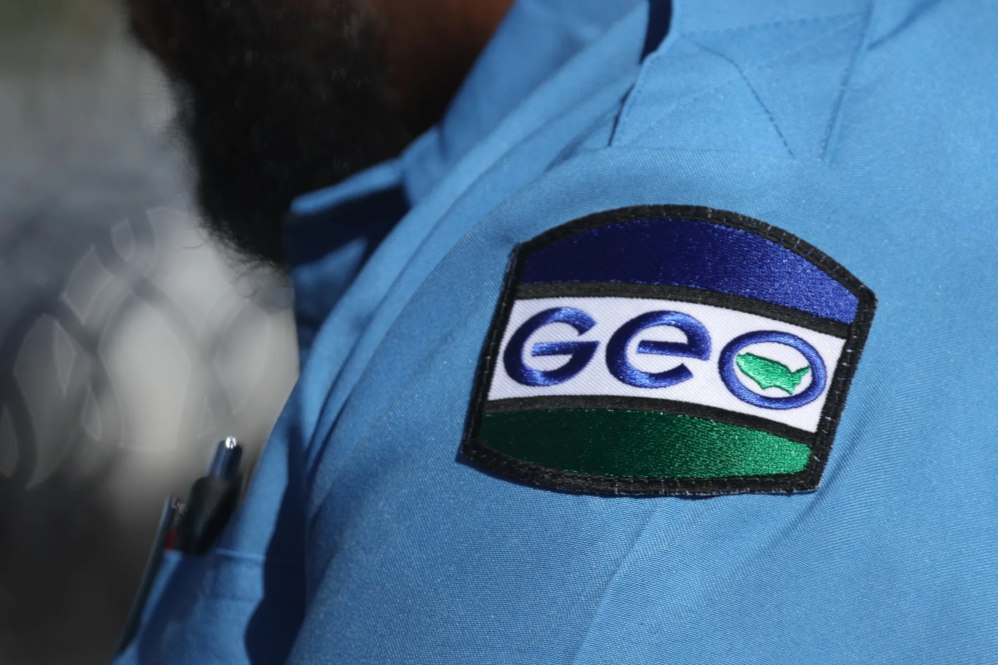 A Geo Group officer outside the Adelanto ICE Processing Center detention facility in Adelanto, California, in July, 2025.