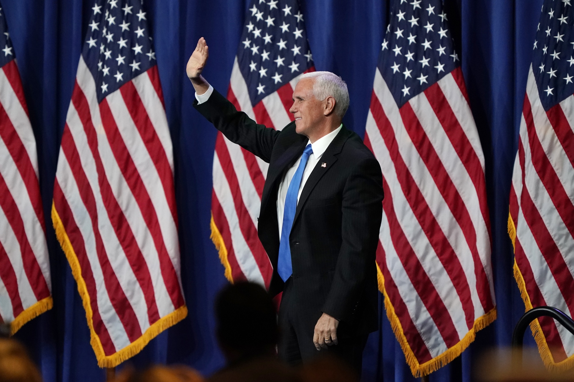Mike Pence waves attends the Republican National Convention in Charlotte, North Carolina, on Aug. 24.