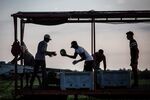 Workers sort harvested watermelons into crates on a farm&nbsp; in Tarragona, Spain.