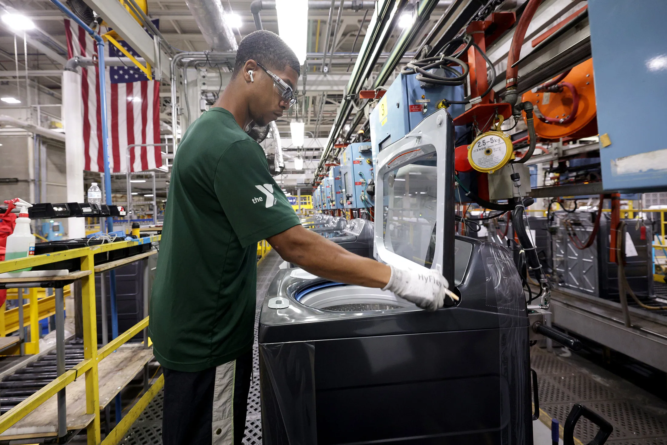 An employee works on the top load laundry production line at GE Appliances in Louisville, Kentucky.