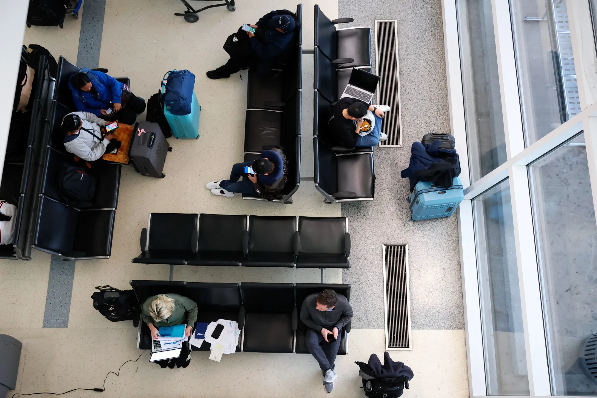 Travelers at Dallas-Fort Worth International Airport in January.