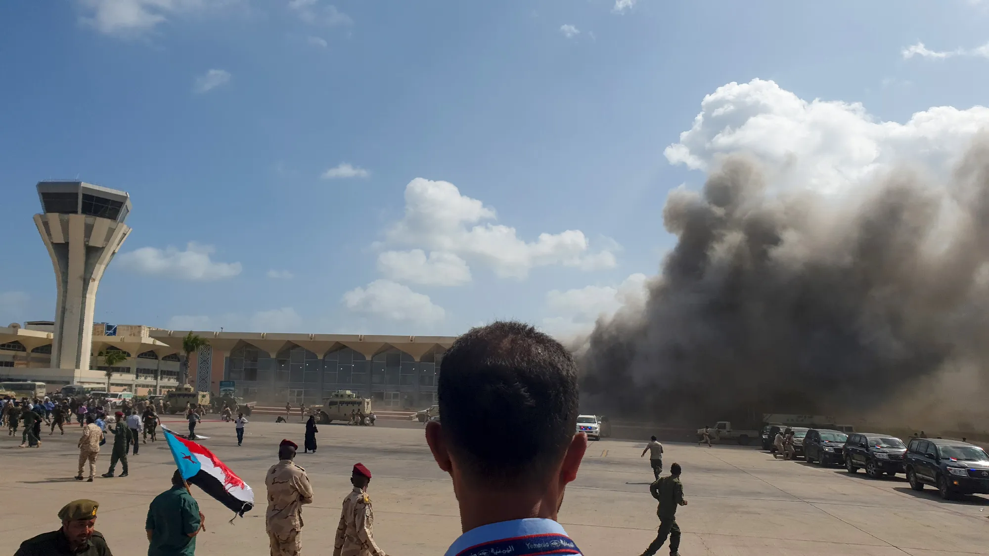 Smoke rises from Aden Airport following multiple explosions, on Dec. 30.