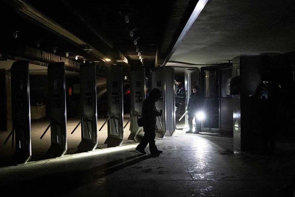 People wait near a metro station after large-scale outages caused by Russia's attacks on Ukraine's energy system on Jan. 31.